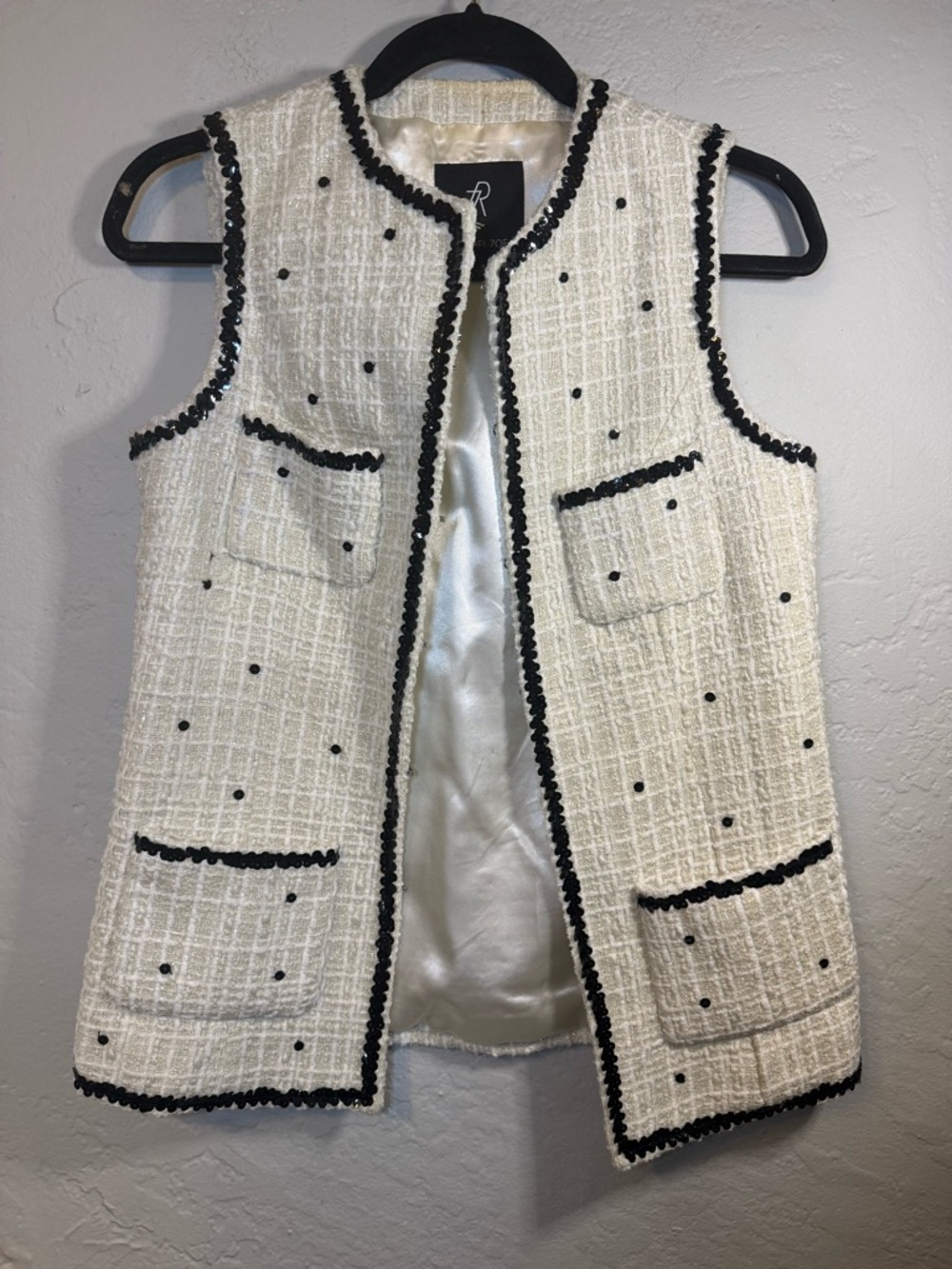 Rachel Zoe white tweed vest featuring black sequin trim and patch pocket